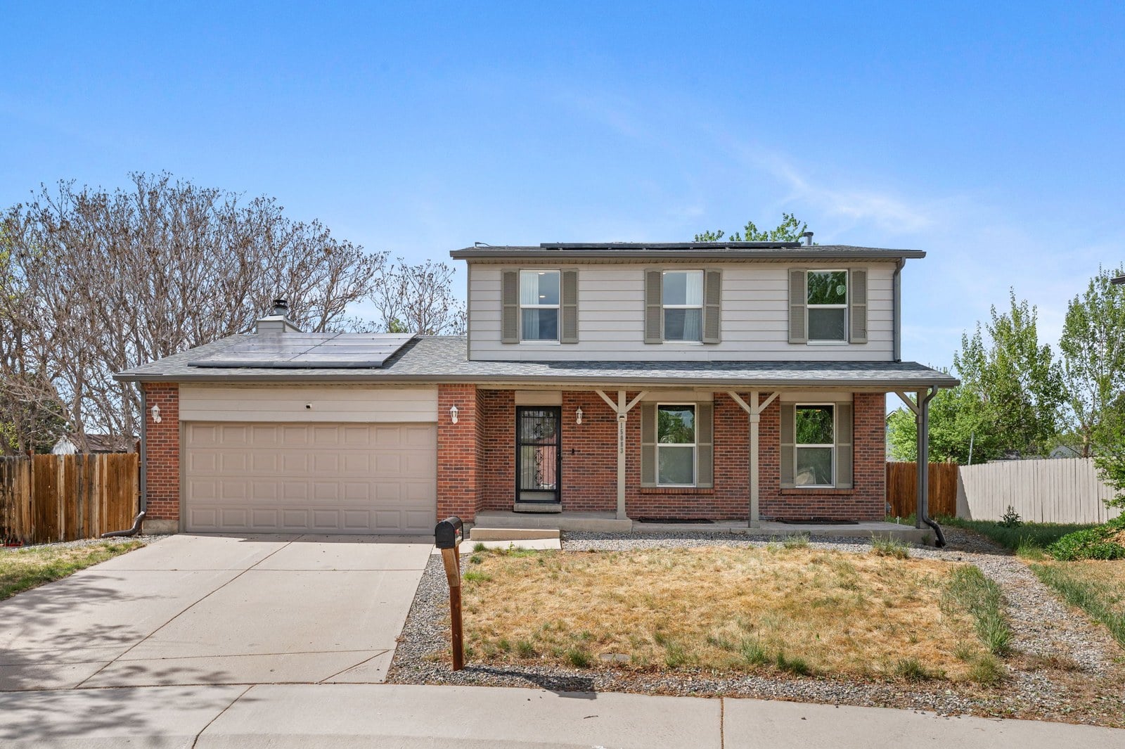 Two-story Denver-area home exterior in early spring