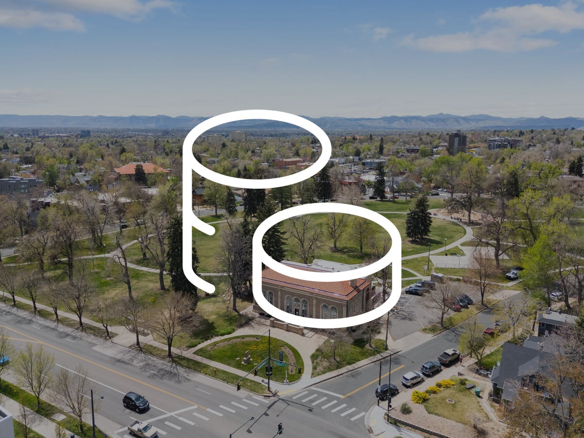 Aerial view of an established Denver neighborhood and park, illustrating whether Denver is more affordable than the Bay Area