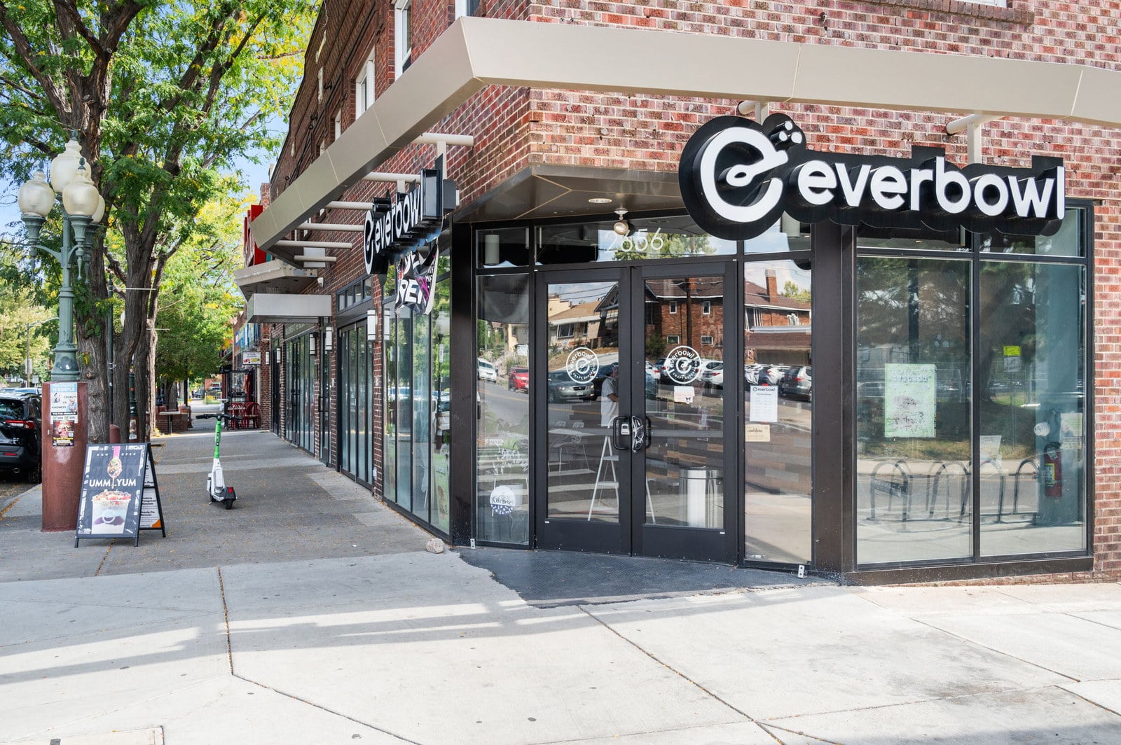 Walkable Denver main street with independent storefronts and sidewalk seating