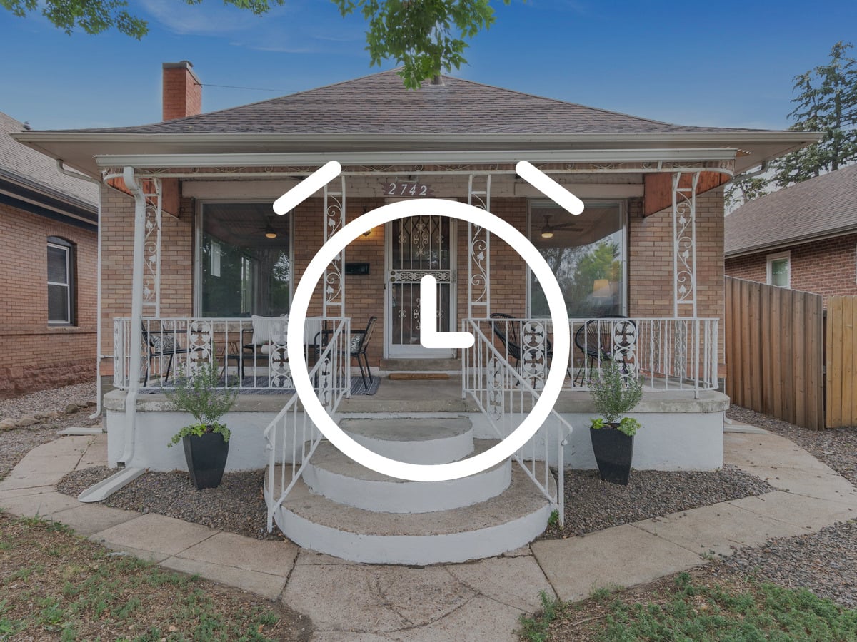 Brick bungalow with a covered front porch in a Denver neighborhood
