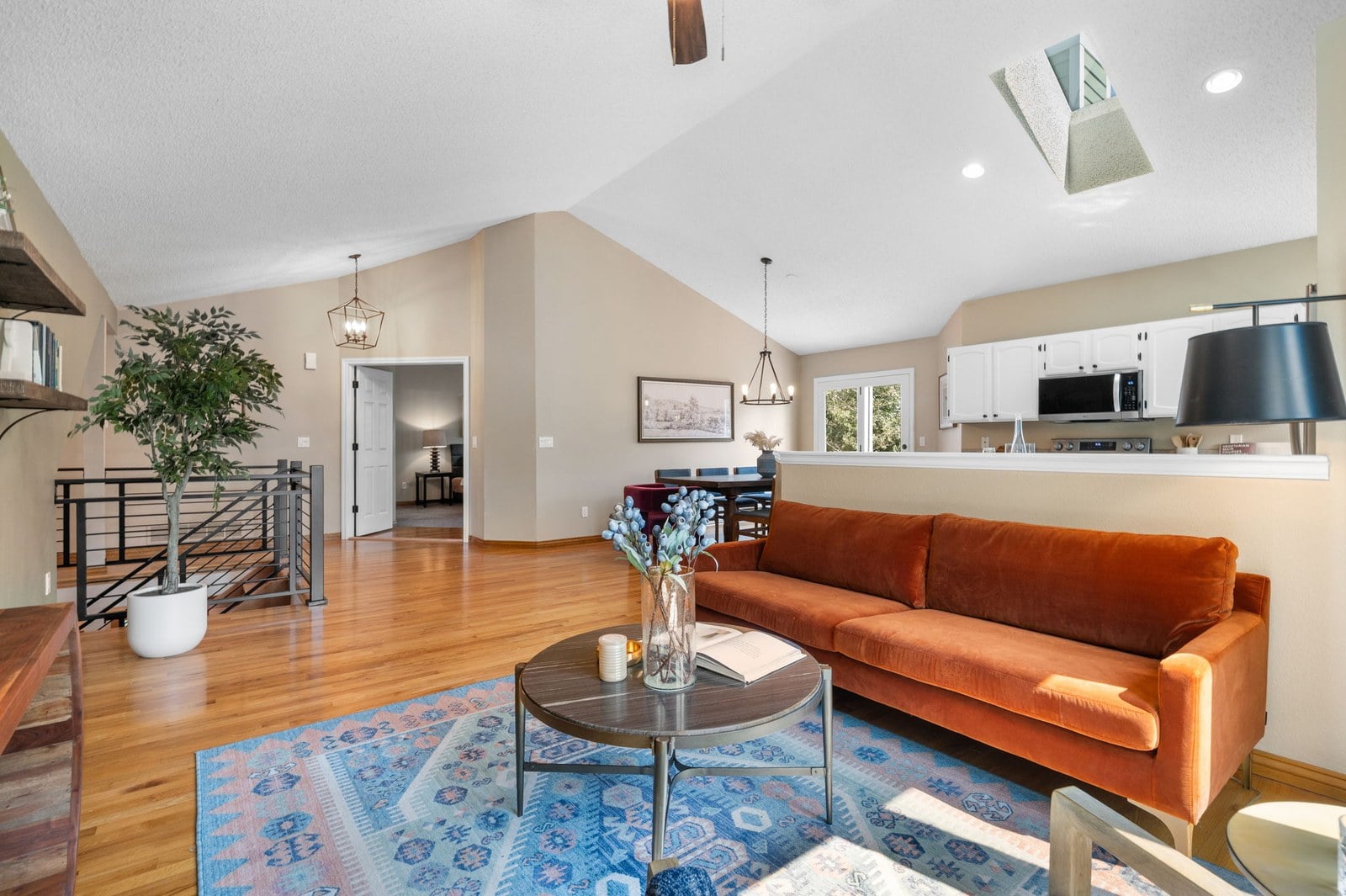 Vaulted, open-concept living room with skylights at 12221 W Prentice Pl in Littleton, Colorado