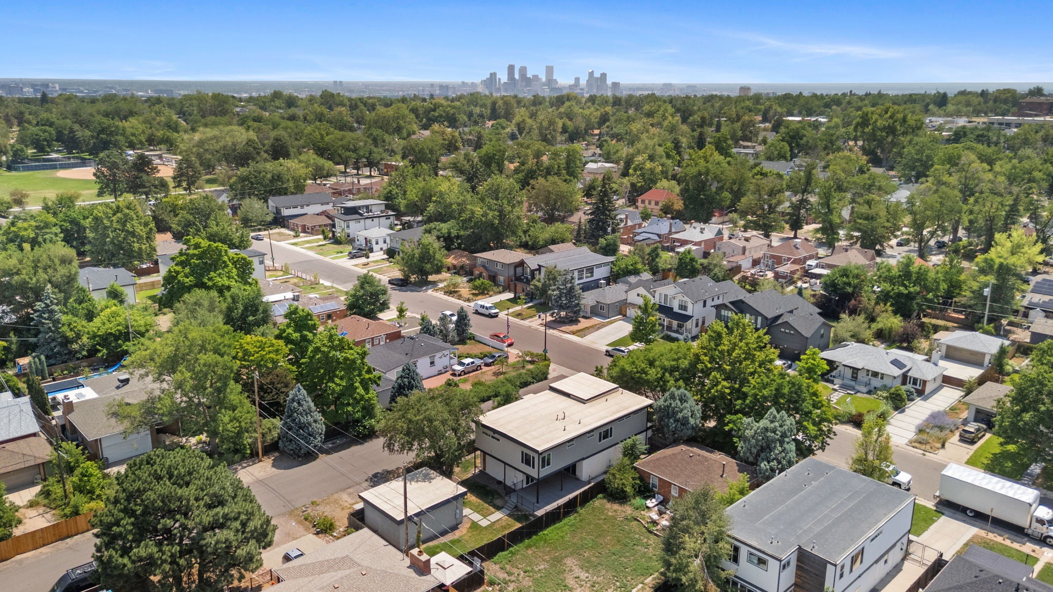 Aerial view of the Berkeley neighborhood in northwest Denver with the downtown skyline beyond