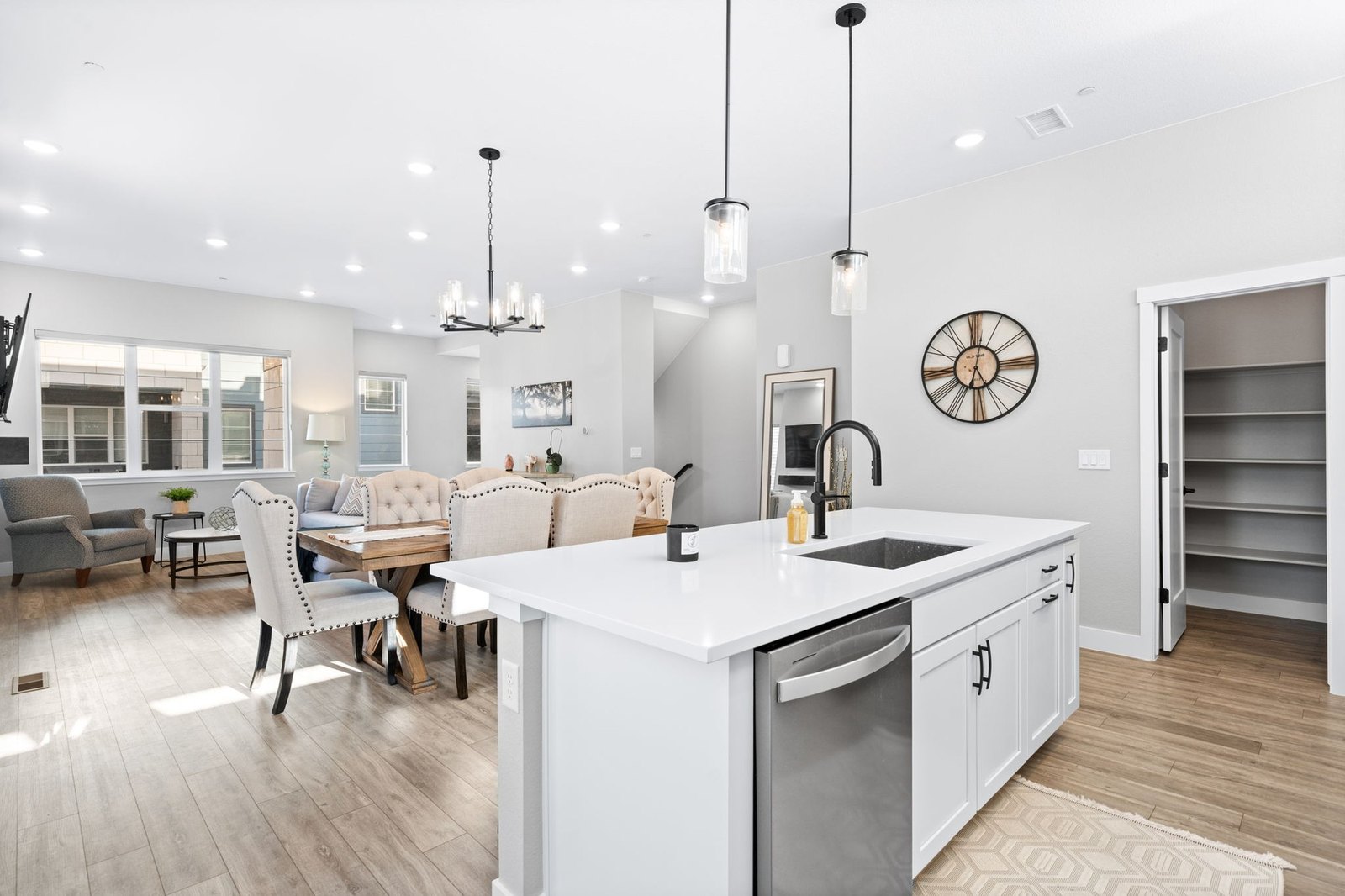 Updated white kitchen with island and stainless appliances in a Denver-area home