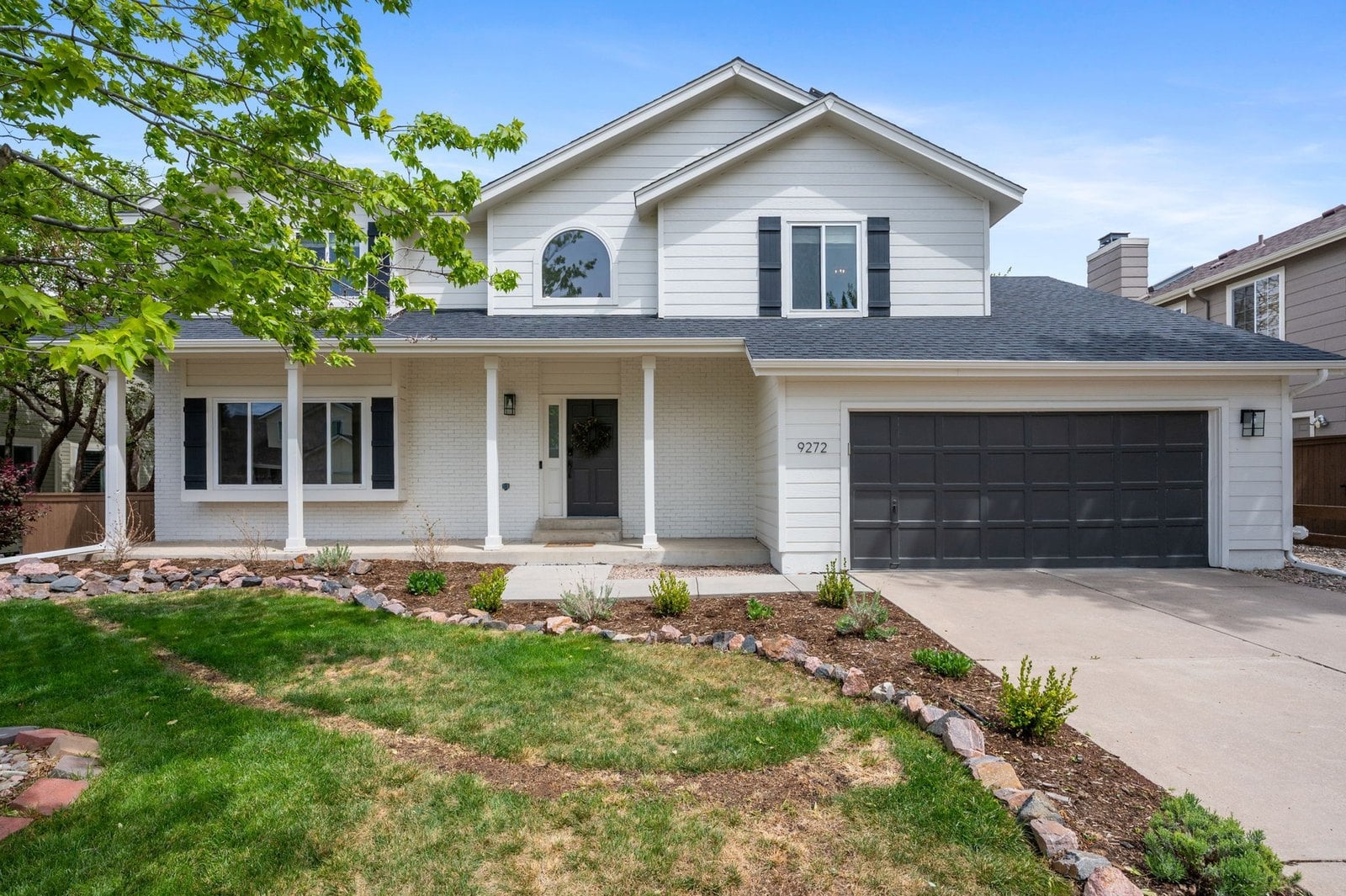 Two-story home with attached garage in Highlands Ranch, a master-planned Denver suburb