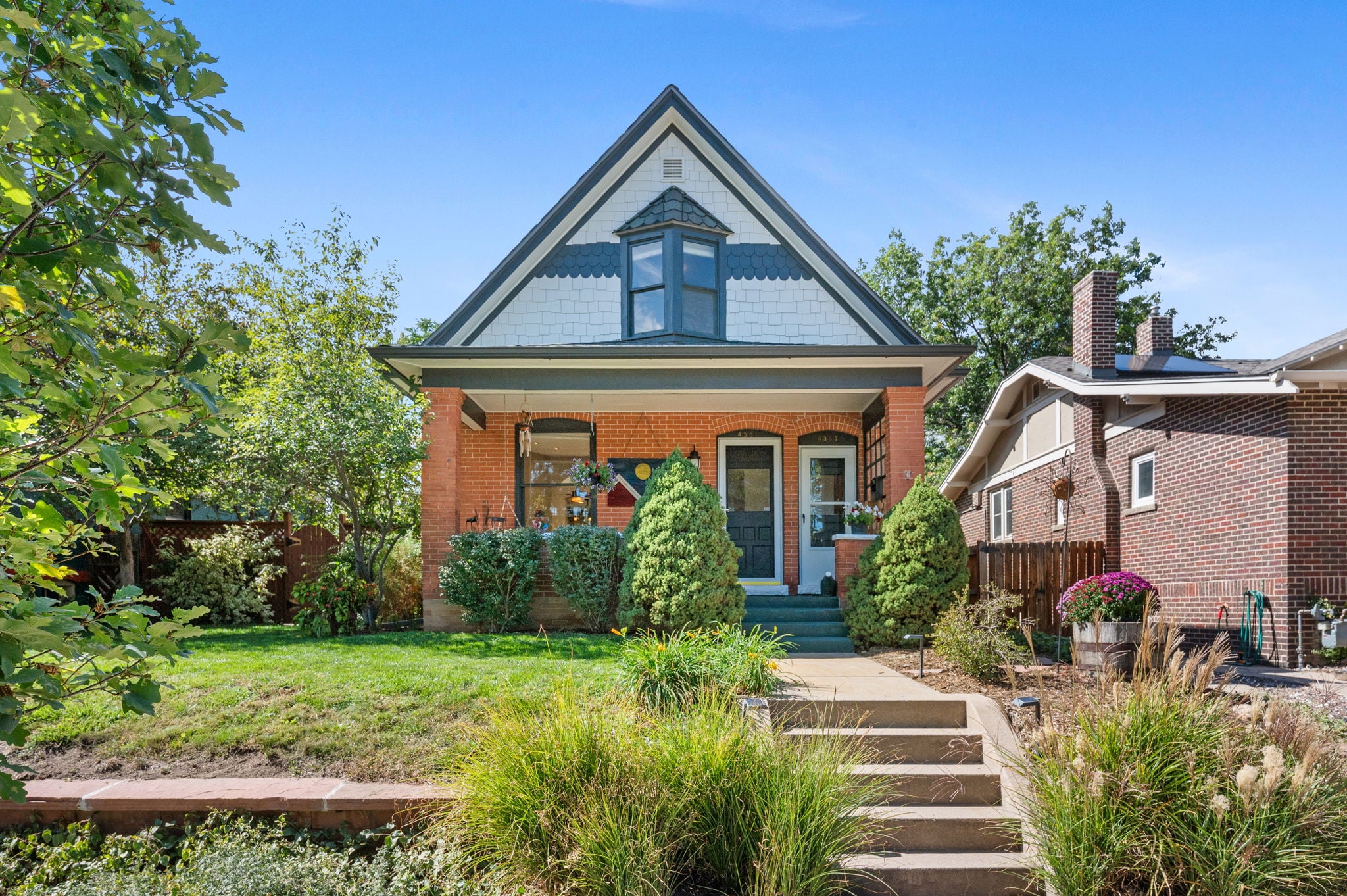 Front exterior of 4581 Bryant St, a 1905 brick Victorian in Sunnyside, Denver