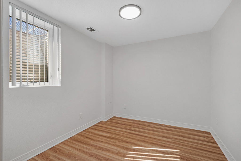 Finished basement bedroom with egress window at 5504 Sable St in Montbello, Denver