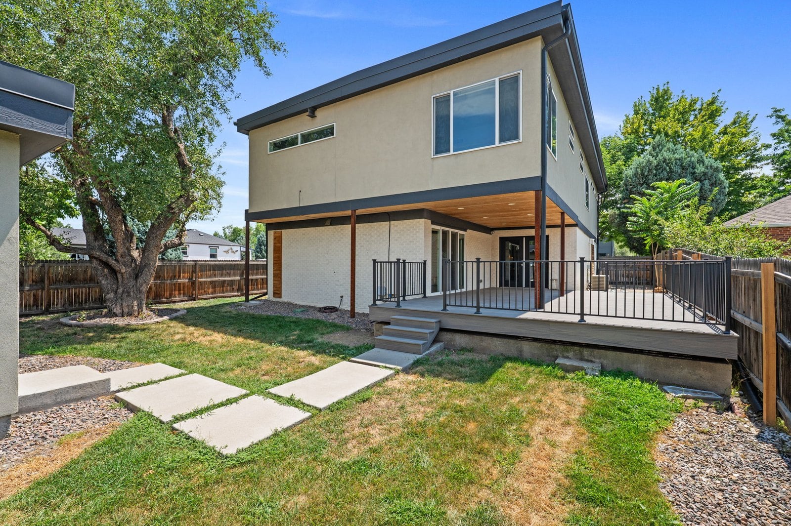 Modern Berkeley, Denver rebuild with covered deck and back yard