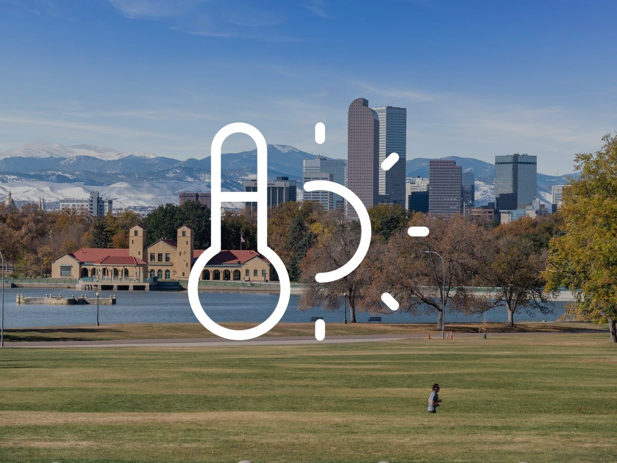 Denver skyline and snowcapped Front Range above Ferril Lake in City Park, Denver winter compared with Chicago's