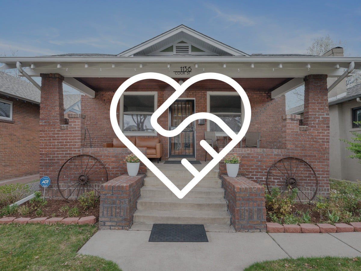 Red brick Craftsman bungalow with a deep front porch, what buyers value in West Highland homes