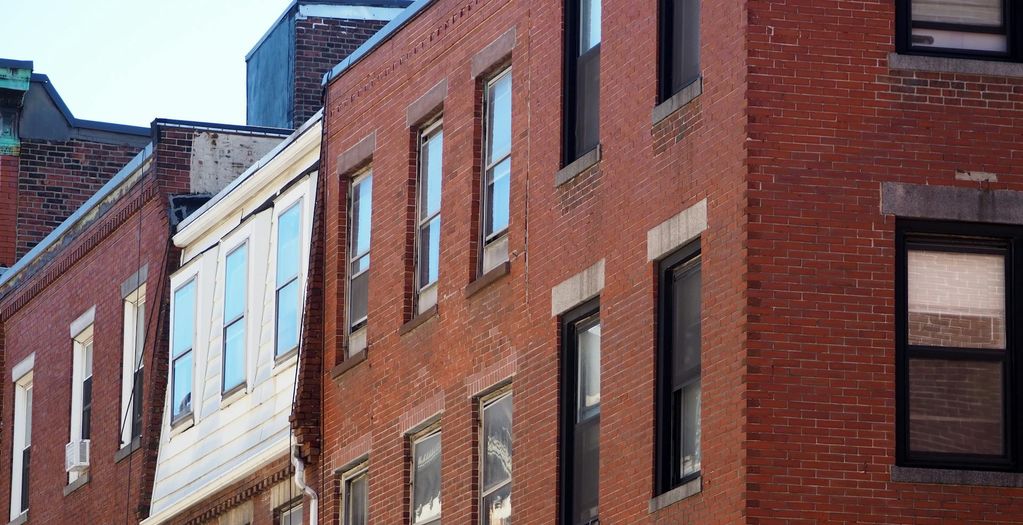 A row of South End brownstones showcasing the classic architecture buyers prize in the luxury market.
