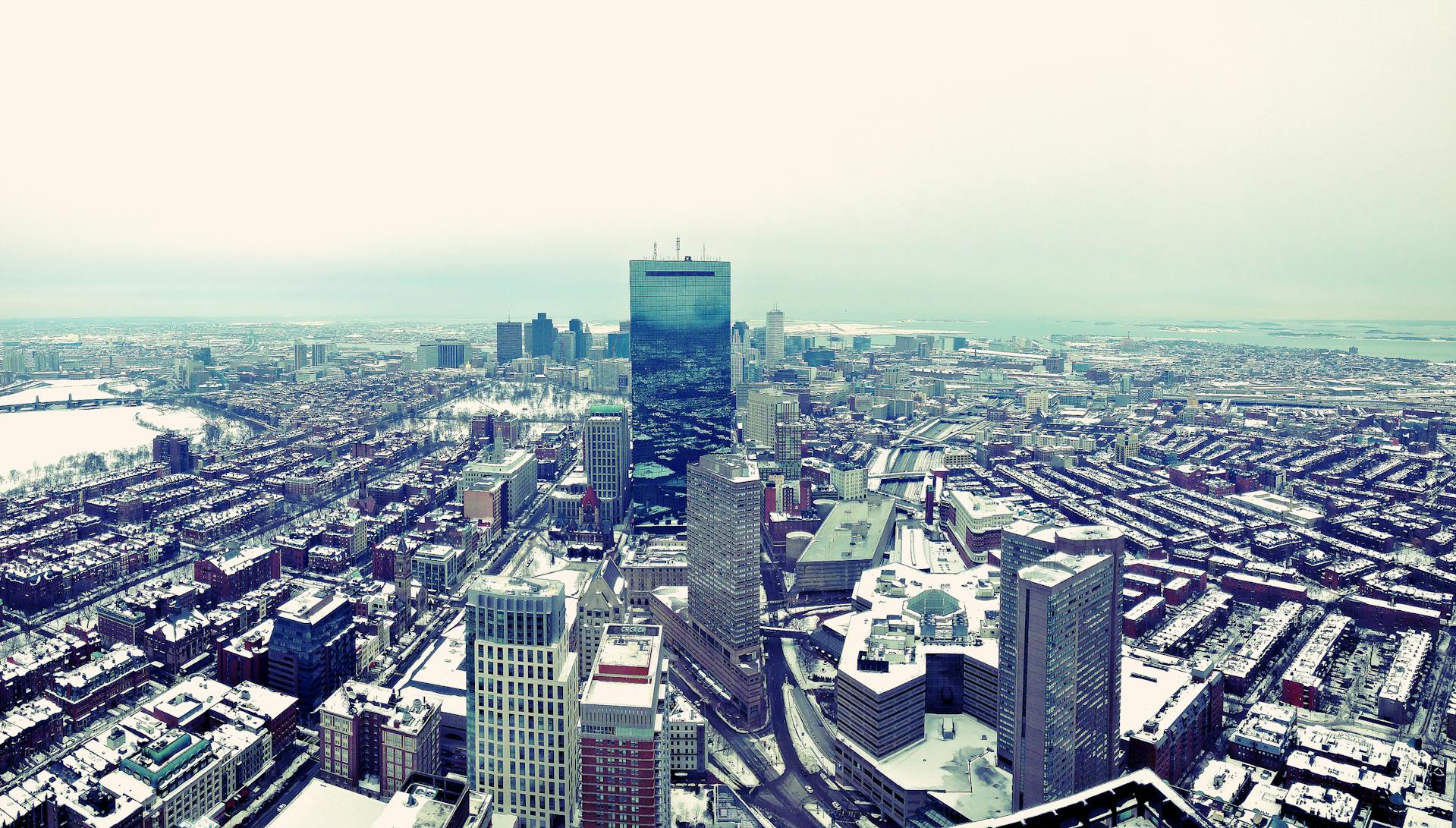 Boston skyline at dusk highlighting luxury condo buildings