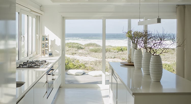 Modern white kitchen with ocean view