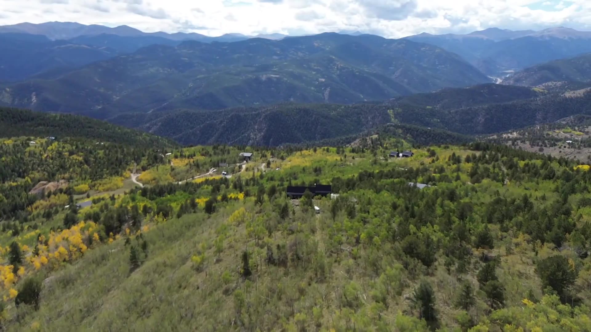 Aerial view of mountain homes and golden fall aspens near Central City, Colorado