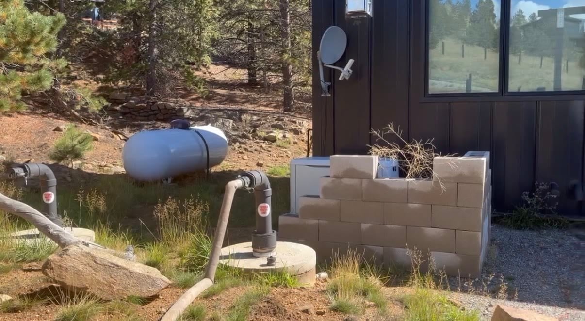 Cistern fill ports marked potable water only at a mountain home in Central City, Colorado