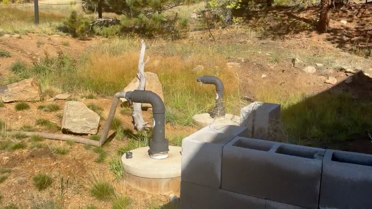 Two capped well heads on a mountain property in Gilpin County, Colorado