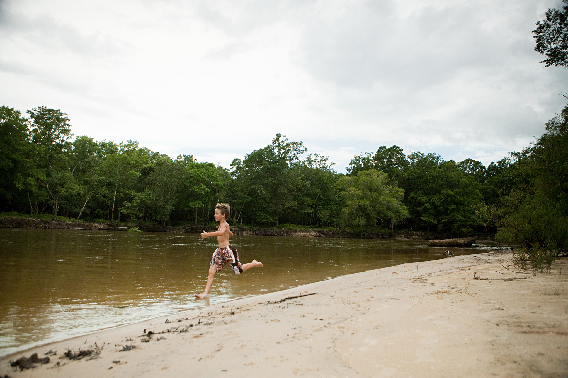 boy-running-into-lake-2024-11-03-05-55-23-utc
