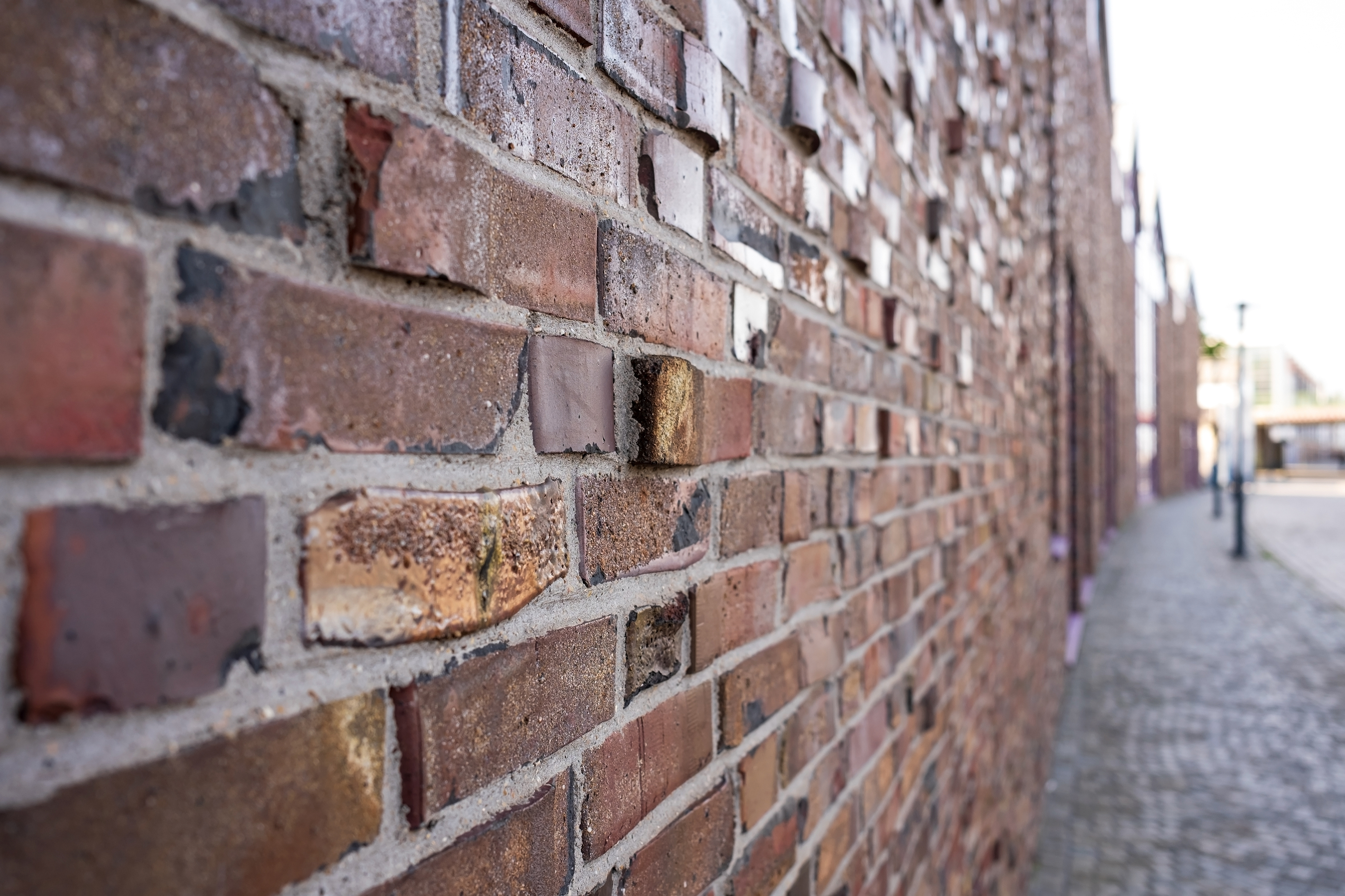 brick-wall-of-an-ancient-building-on-the-street-of-2025-01-15-12-54-21-utc