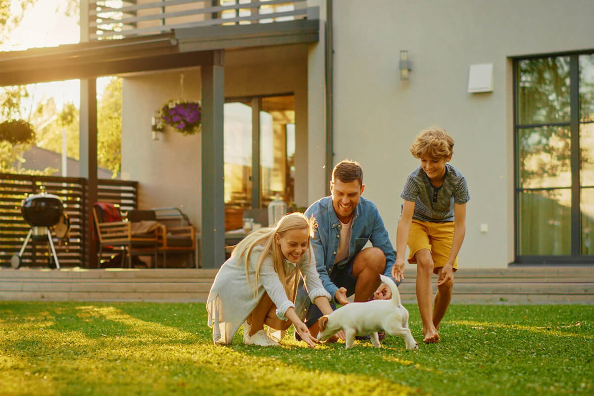 Family spending time together in the backyard of a home