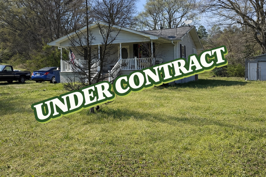 House under contract with green shadow
