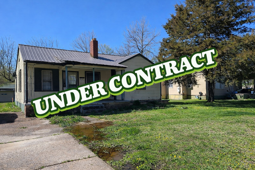 House with _Under Contract_ sign