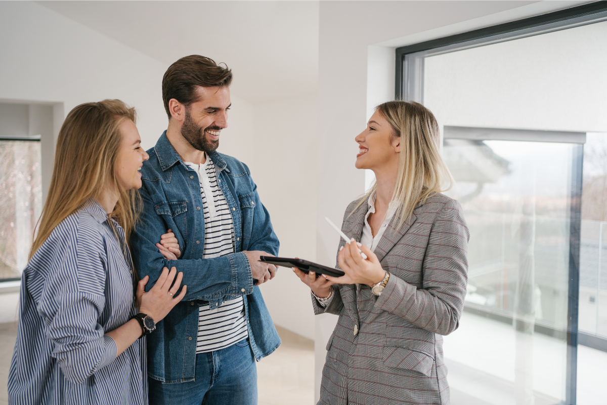 Couple Laughing With Agent