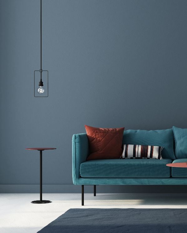 Interior of the living room in blue with a sofa-small