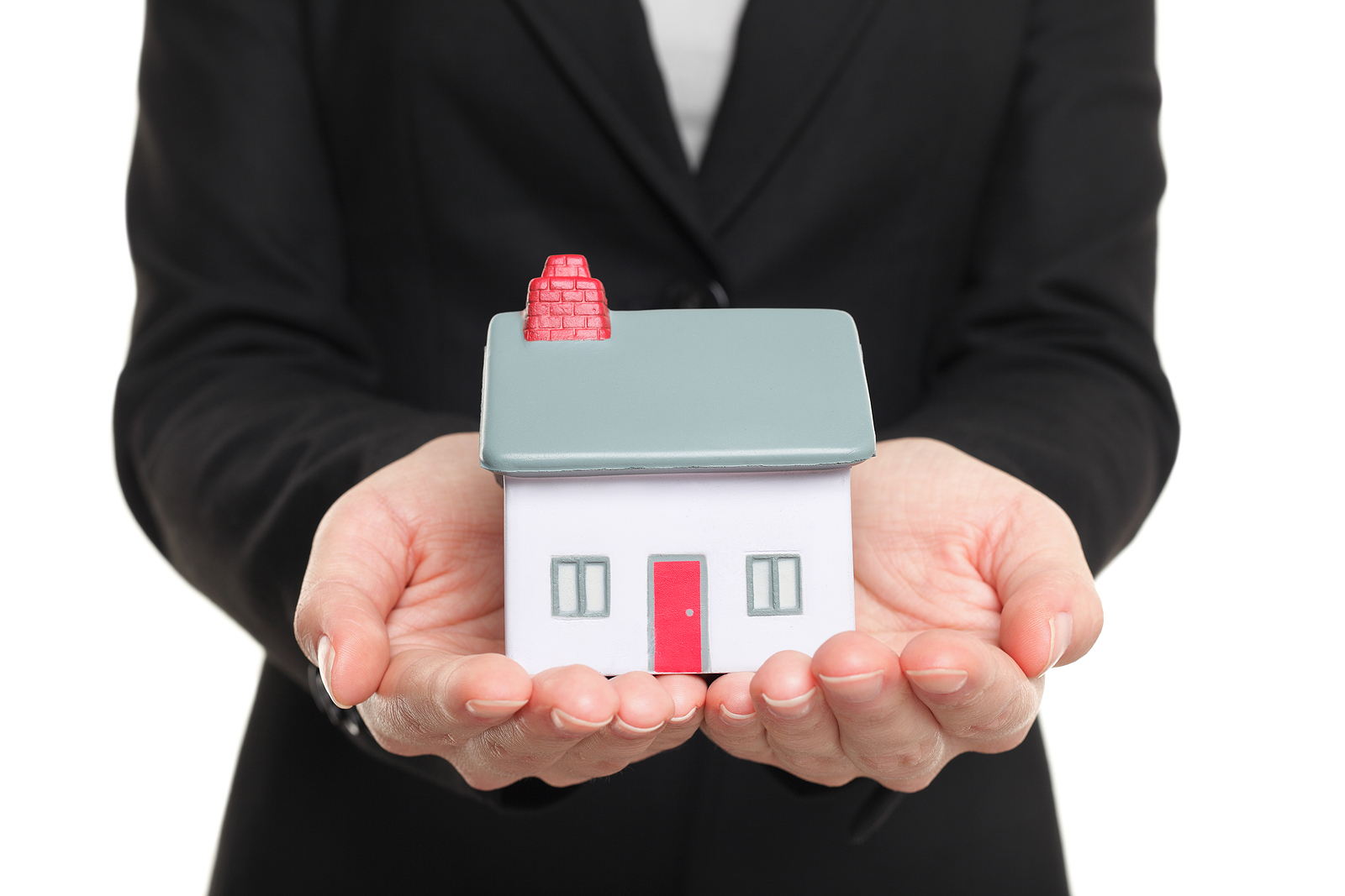 New Home and house owner concept. Woman holding a model house. C