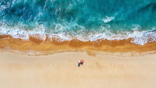 Tropical beach with colorful umbrellas