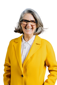 April Ralph, REALTOR, smiling in a bright yellow coat, facing the camera against a transparent background.