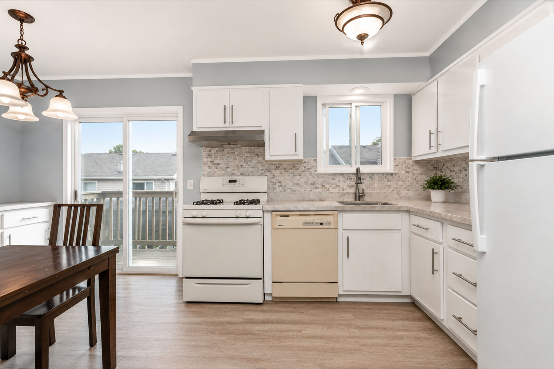 29 Wood Court Kitchen With White Cabinets And Deck Access