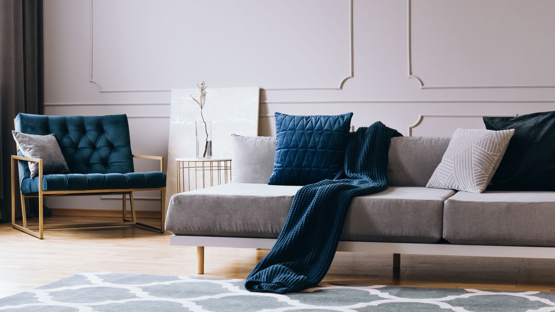 Grey monochrome living room interior with blue accents