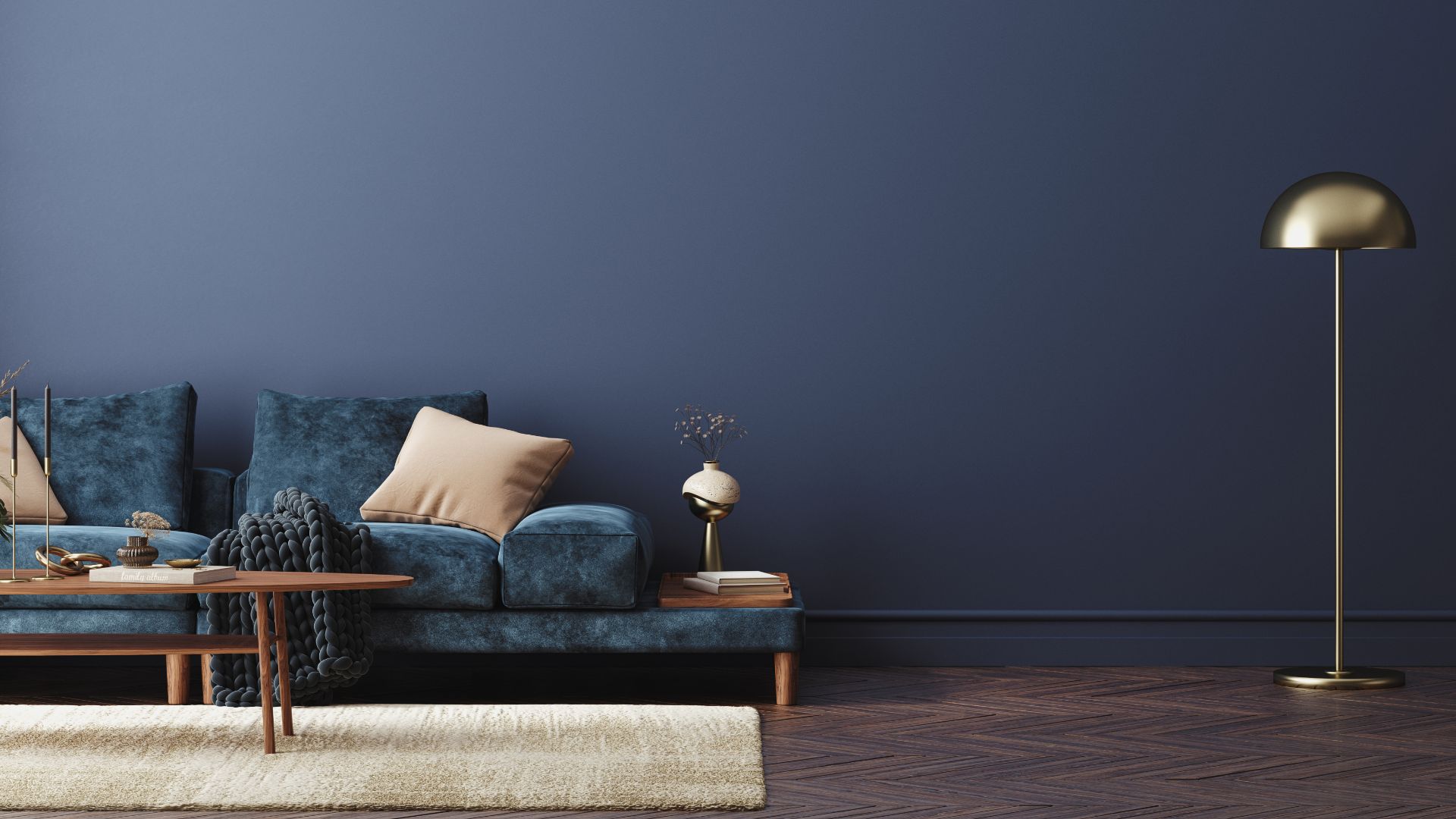 Home interior with blue sofa, table, and decor in living room