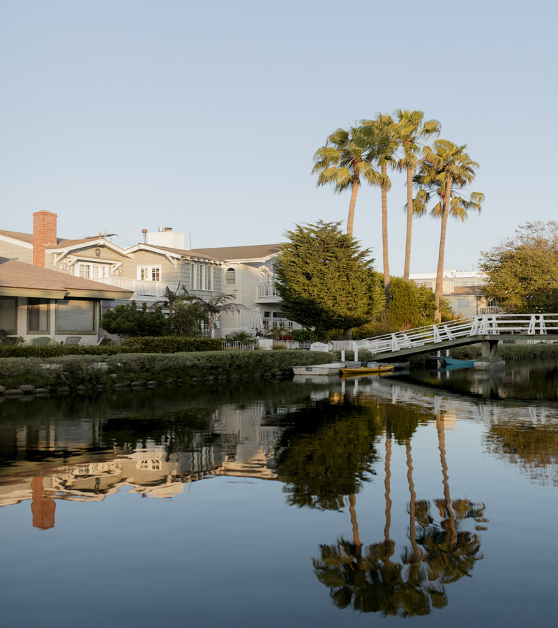 houses-at-calm-pond-2023-11-27-05-12-10-utc