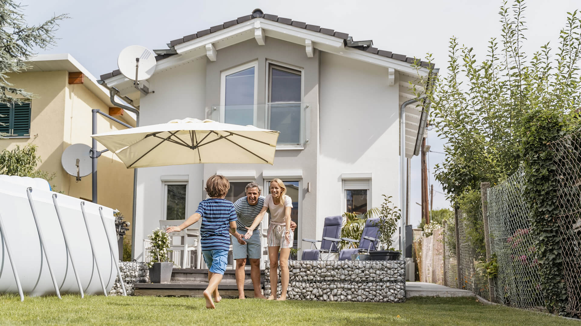 boy-running-in-garden-towards-parents-2024-09-16-01-11-36-utc (1)