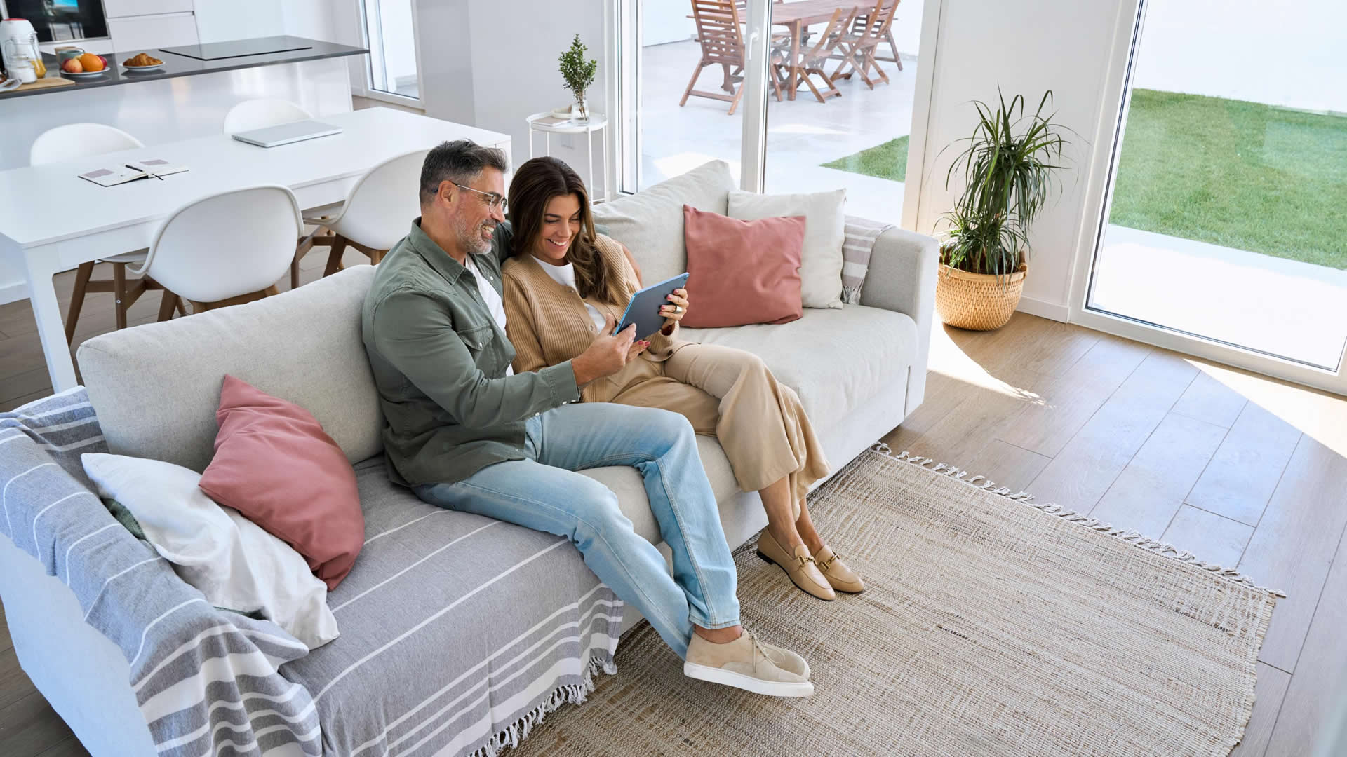 happy-mature-old-couple-hugging-sitting-on-sofa-at-2025-02-11-16-24-06-utc (1)