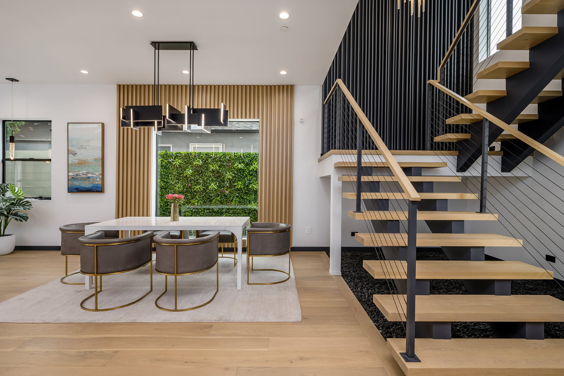 an-open-kitchen-with-a-staircase-leading-to-a-dini-2025-02-10-06-18-07-utc