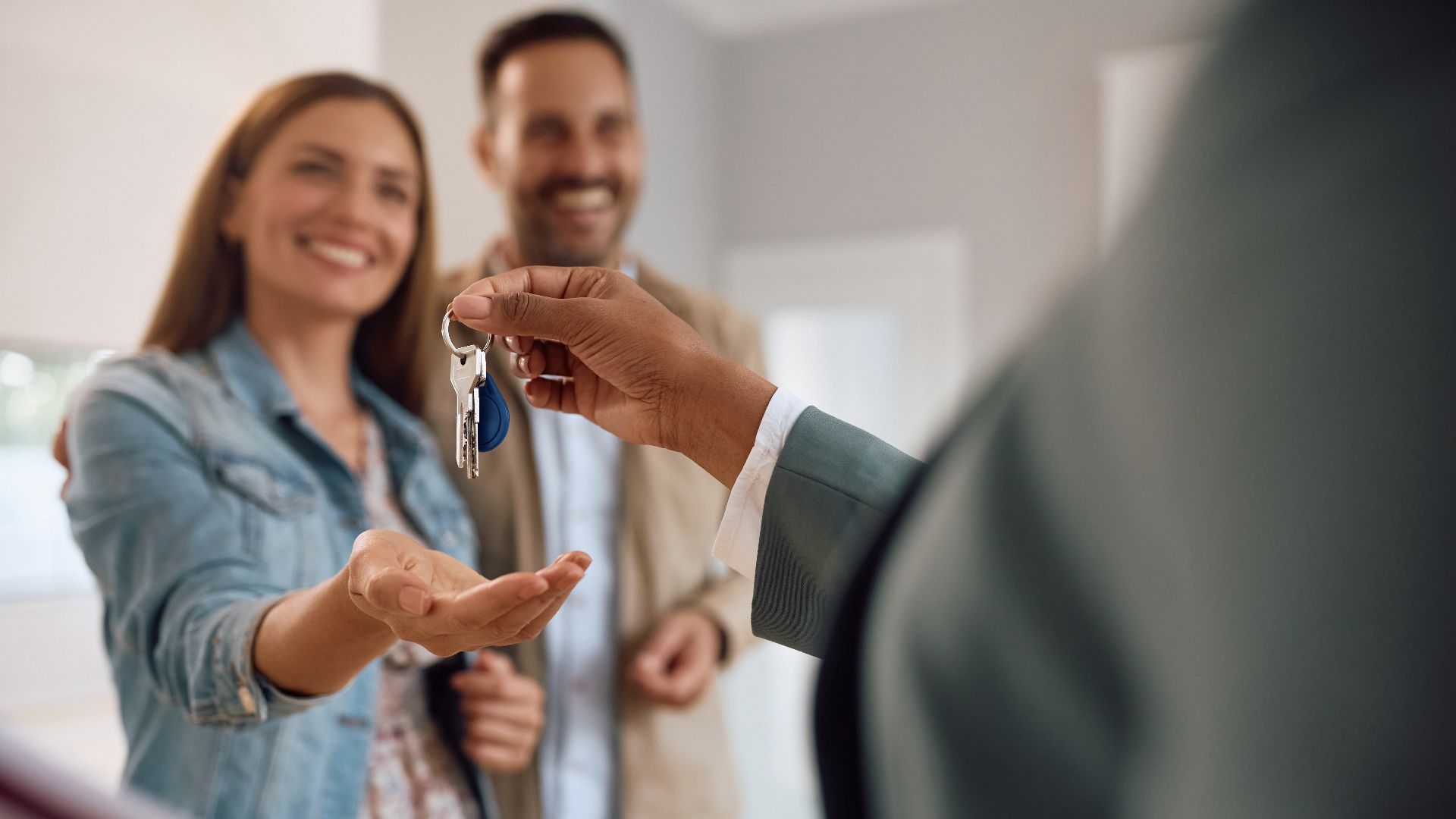 106. happy couple receiving keys of their new home