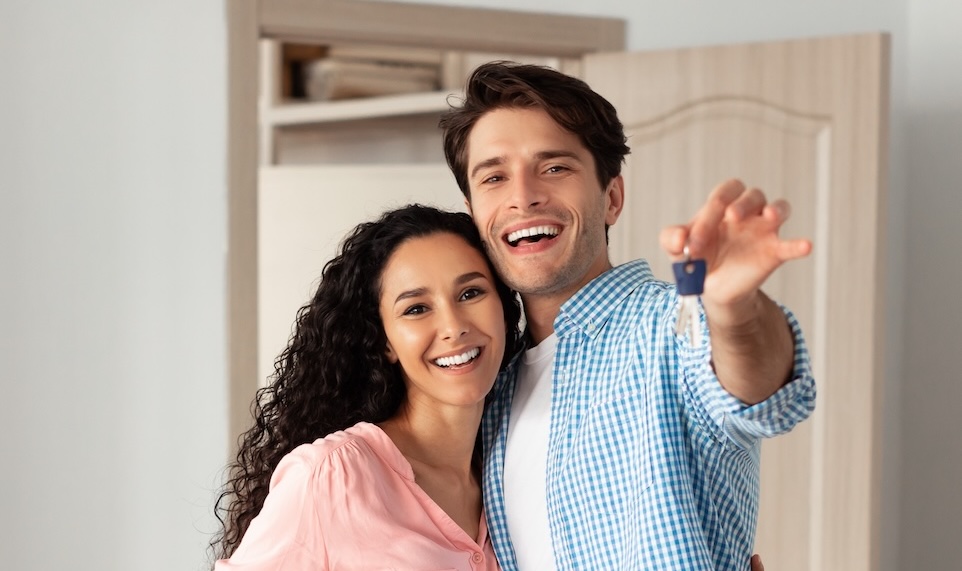House,Ownership.,Portrait,Of,Happy,Young,Couple,Holding,Showing,Key