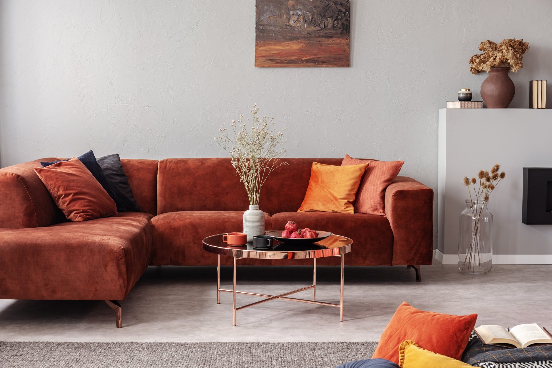 Fashionable velvet corner sofa with pillows