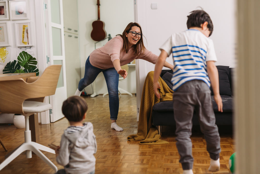 mother playing with their kids at home