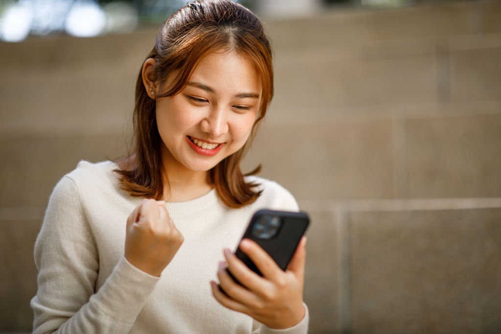 Portrait of young student girl, Excited student checking smartph