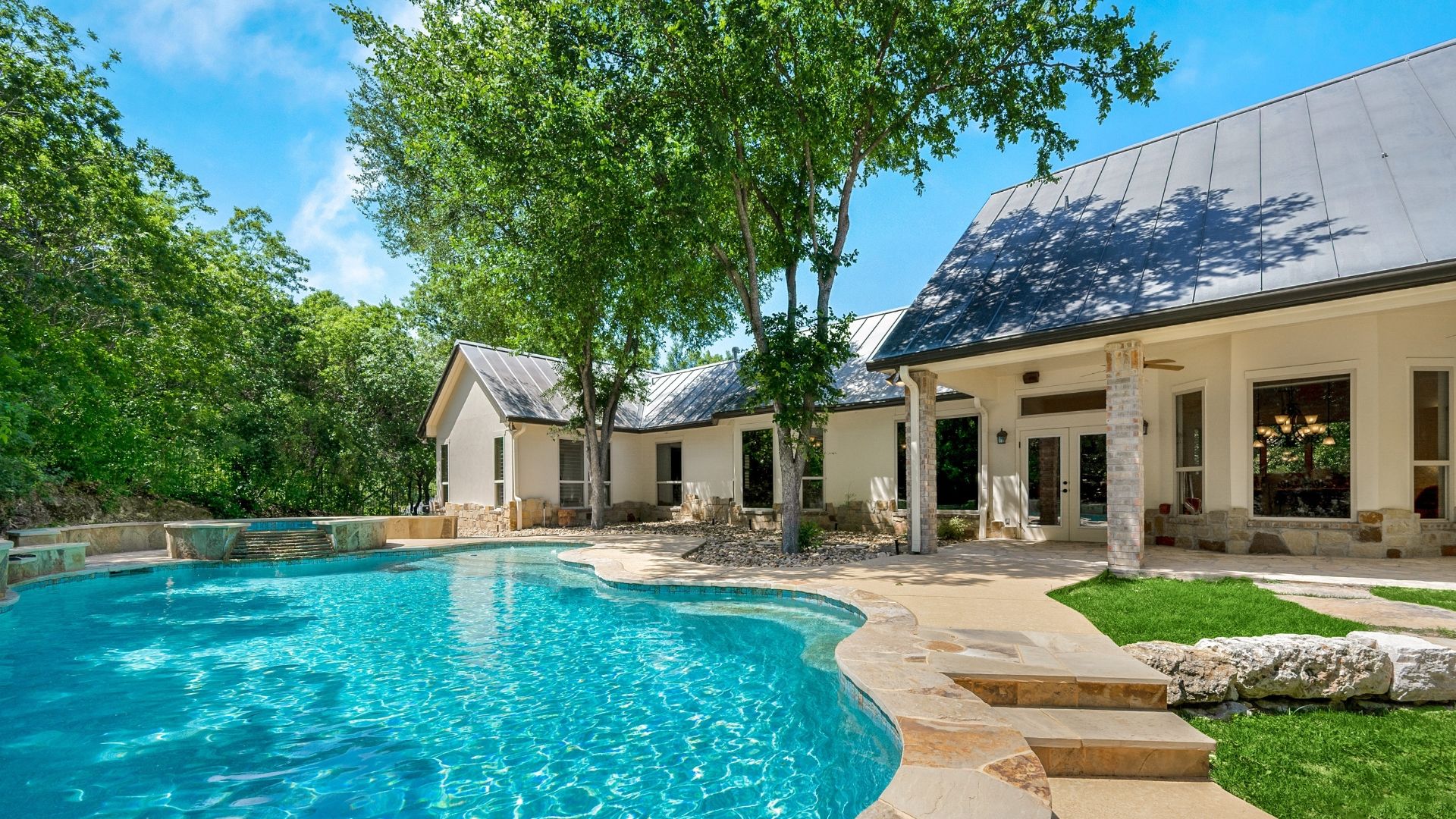 A home back yard with a swimming pool