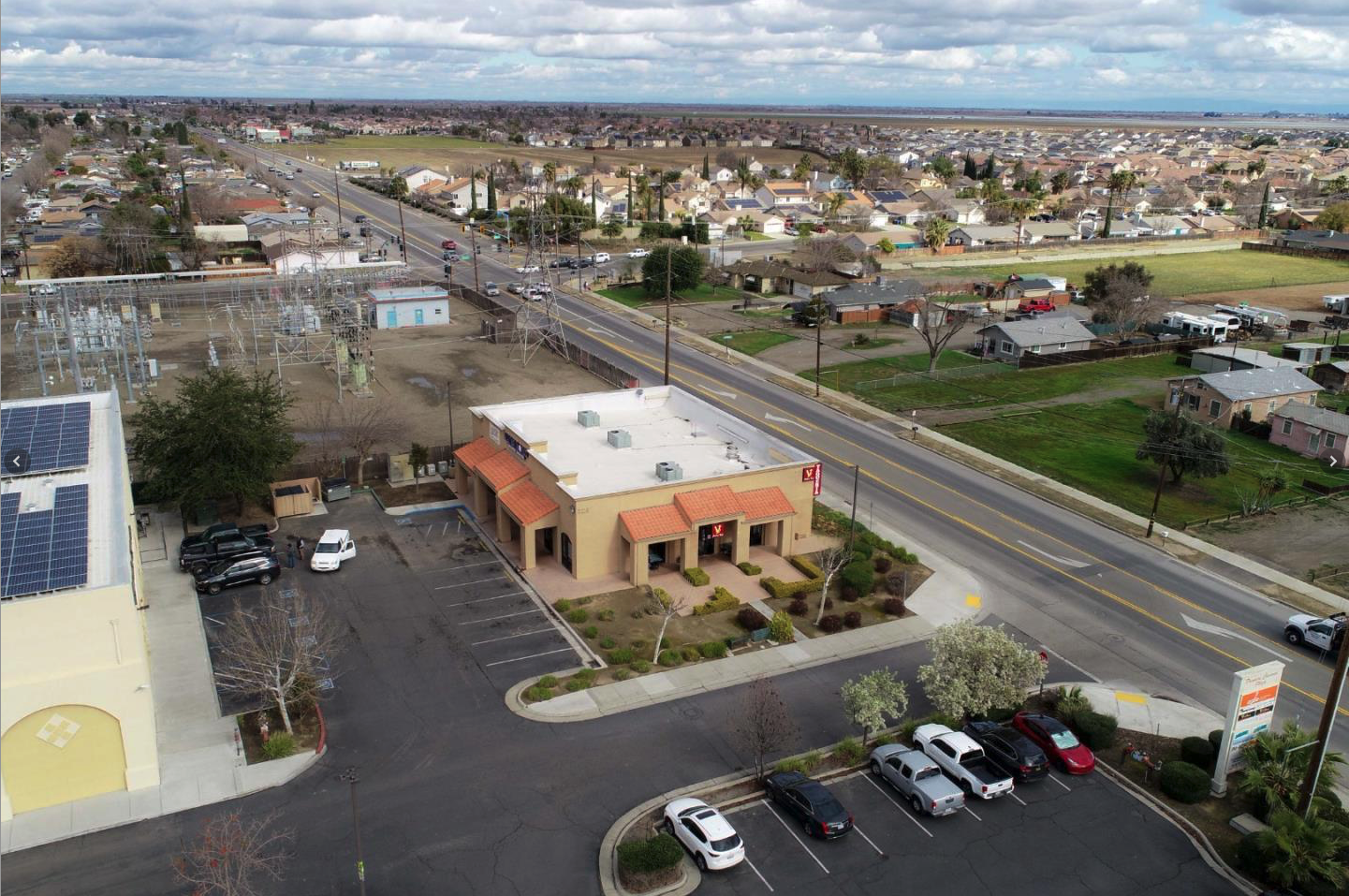 Aerial view of solar-equipped roof and surrounding neighborhood Los Banos