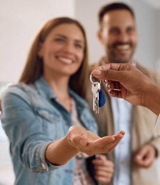 106. happy couple receiving keys of their new home65x75