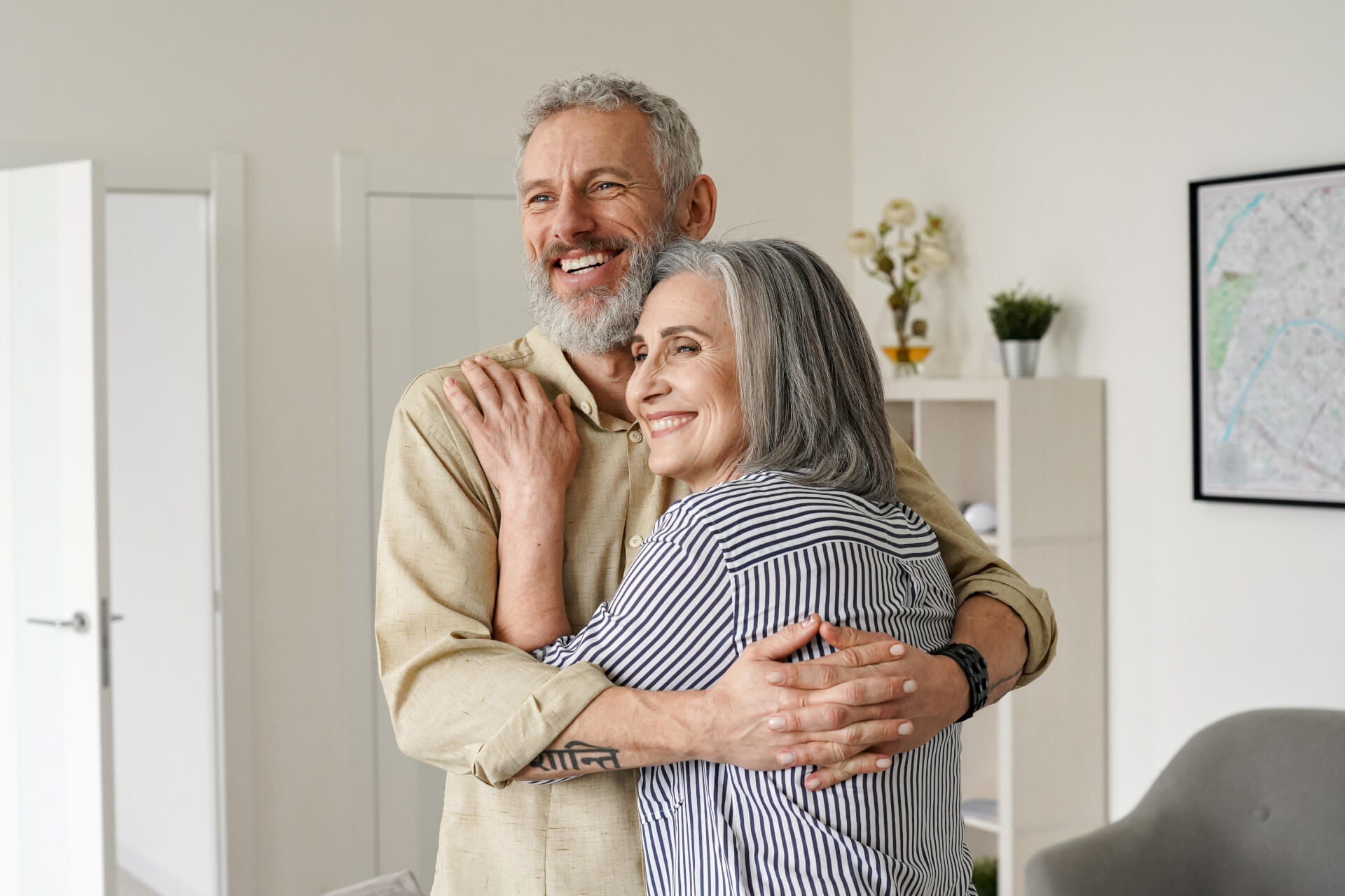 Happy senior adult mature classy couple hugging