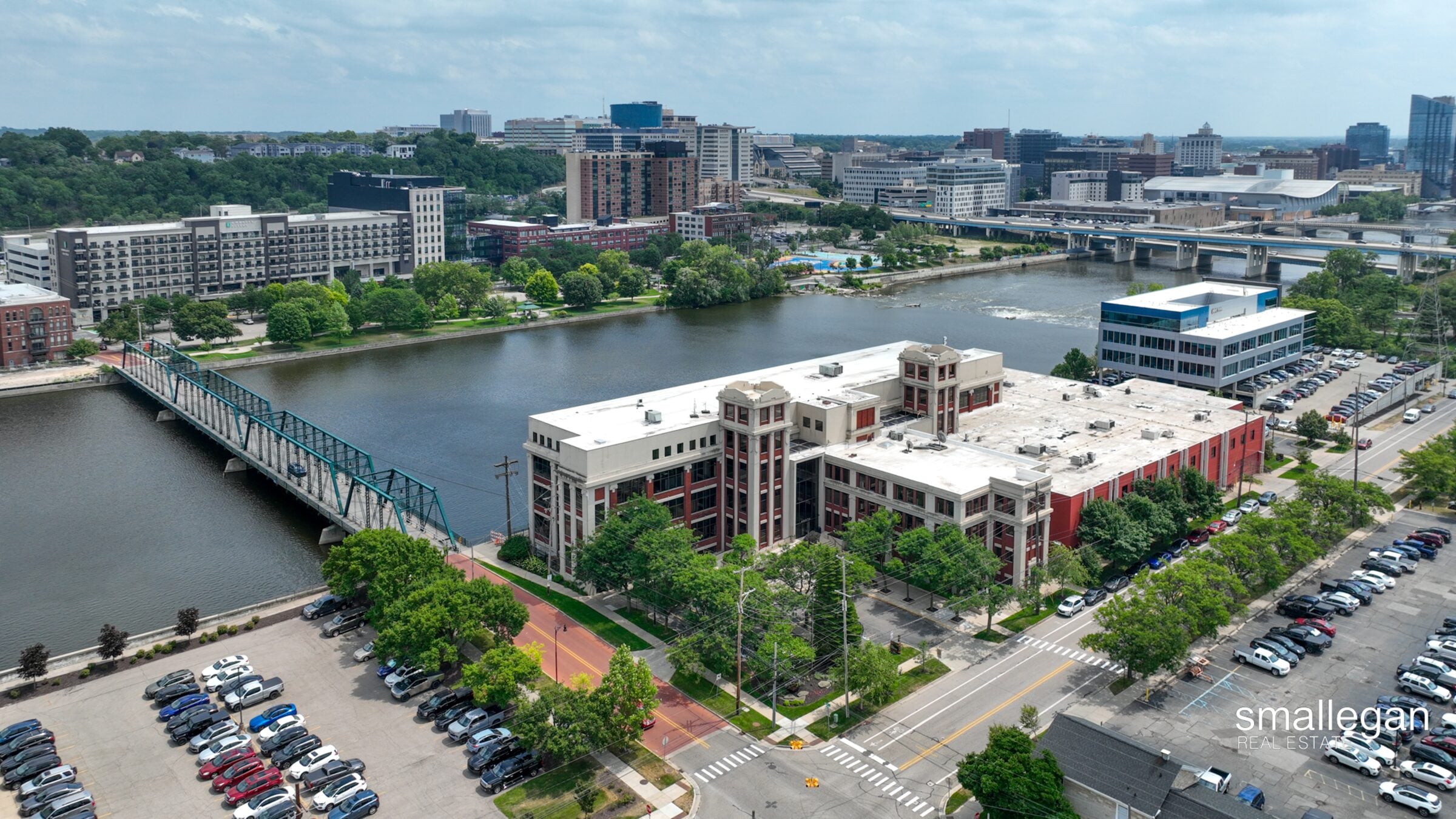 Aerial view of the Smallegan Real Estate office building beside the Grand River in Grand Rapids, Michigan