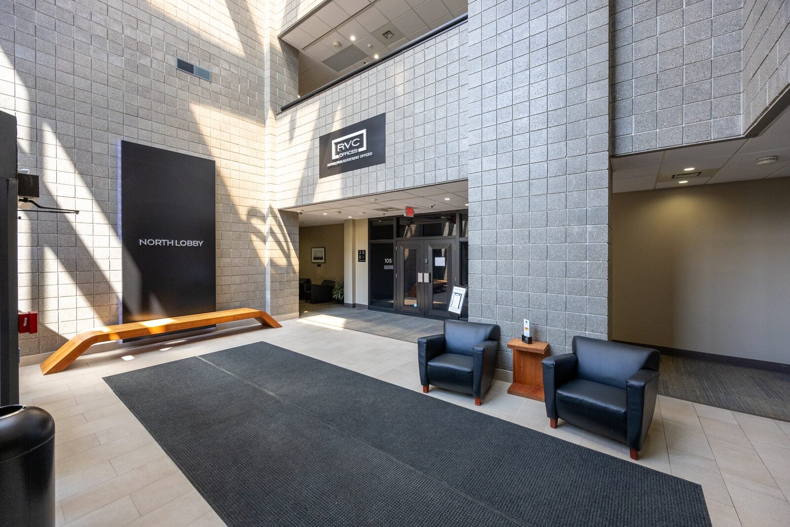 Bright modern lobby with lounge seating at the Smallegan Real Estate office in Grand Rapids