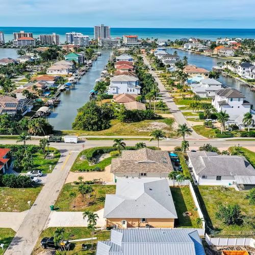 New to Market: 507 99th Ave N — Elevated Naples Park Pool Home at $1.365M