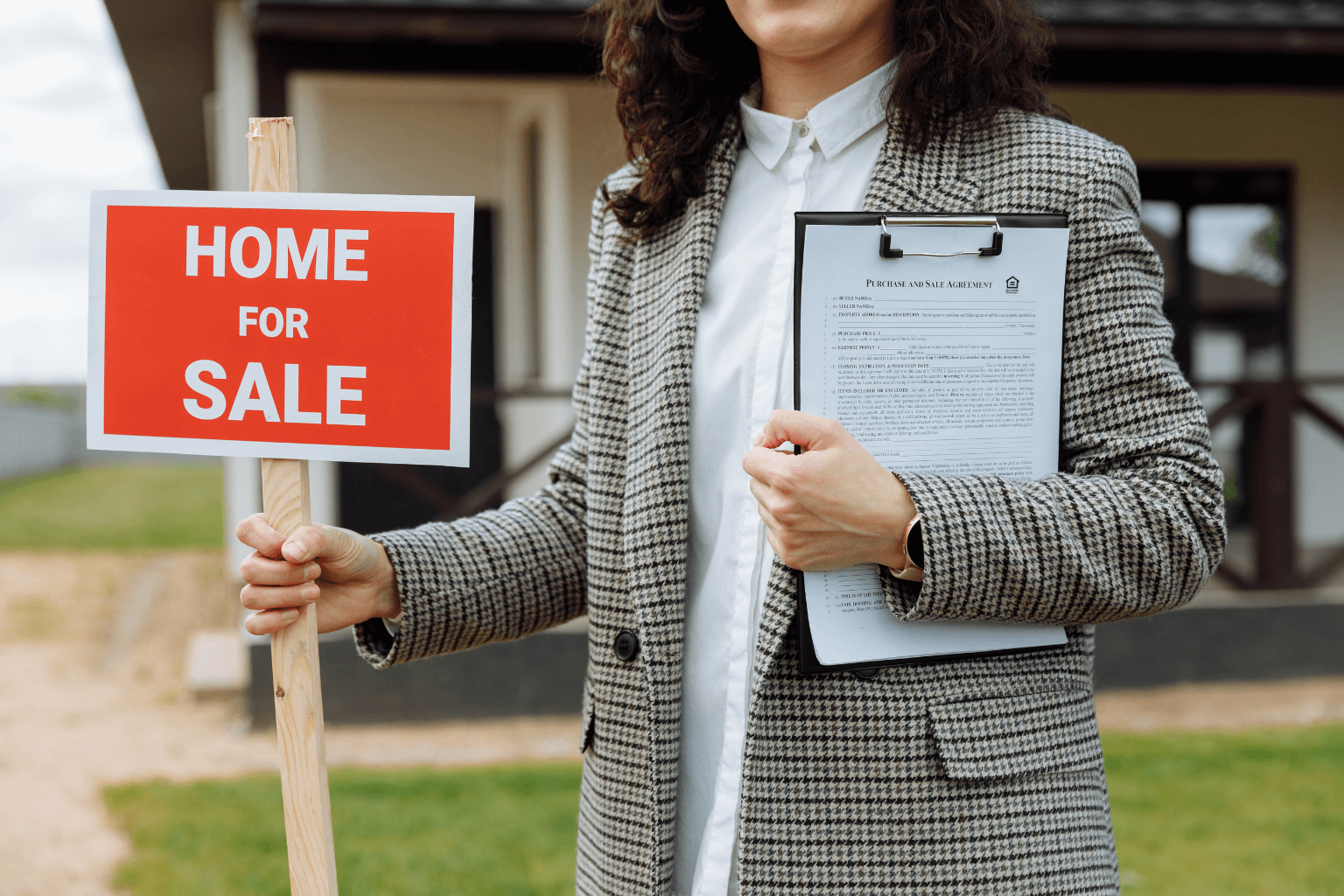 Home for sale with real estate sign in Clayton neighborhood