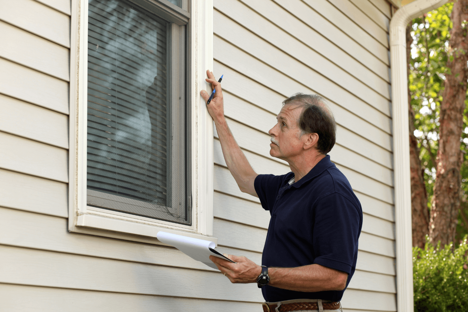 Professional home inspector evaluating a property